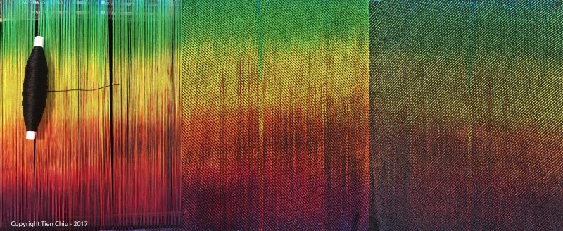 Handwoven sample showing the effects of black weft on your painted warp. 3/1 twill. 10/2 cotton warp and weft, sett 30 epi (12 epc). 3/1 twill structure., black weft.
