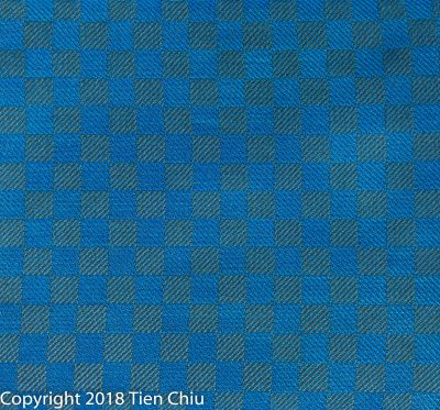 handwoven cloth woven in low-contrast colors - turquoise and gray