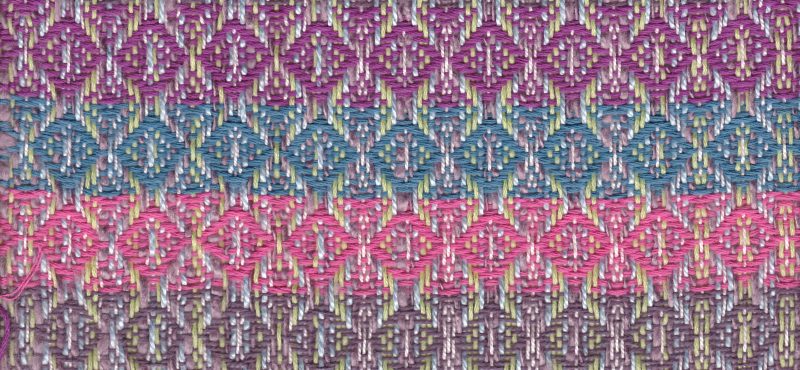swatch with four equal stripes of each weft color