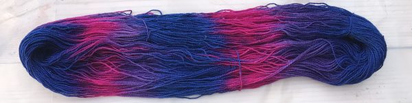 Painted skein in purples, blue, and magenta - colors that follow the Two primary Rule