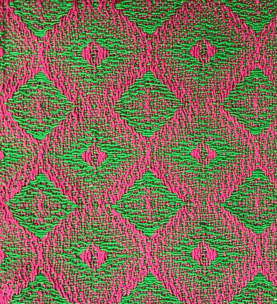 swatch woven from draft above - partially blending draft, advancing twill - in magenta and green yarns